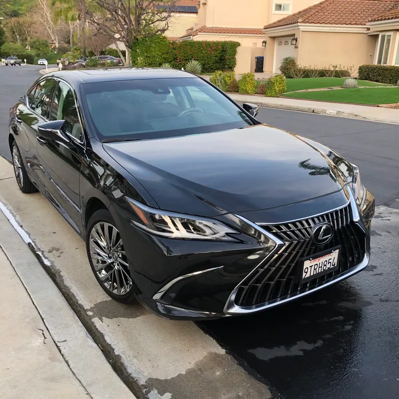 A black Lexus ES detailed at the curbside on a residential street in Calabasas, CA
