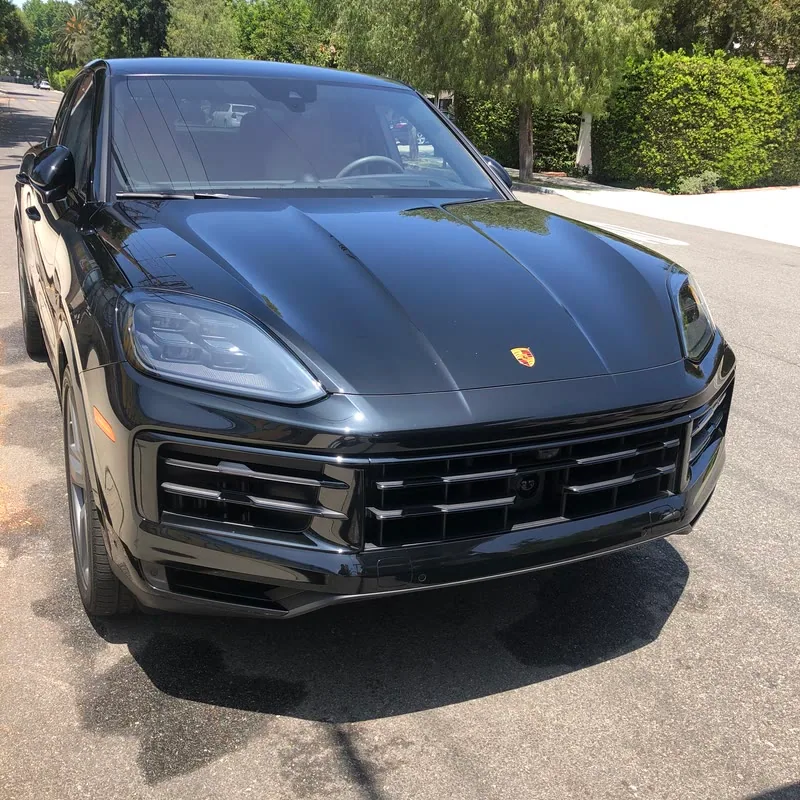 A black Porsche Cayenne Coupe detailed on a private street in Hidden Hills, CA